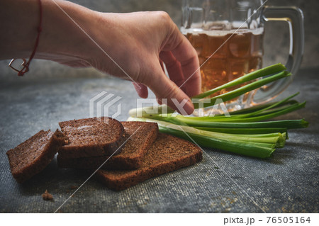 Bread with salt, green onions and beer Bread with salt, green onions and beer 76505164