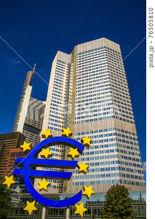 Symbol of Euro currency in front of skyscraper in financial downtown of Frankfurt, Germany, Symbol of Euro currency in front of skyscraper in financial downtown of Frankfurt, Germany, 76505810