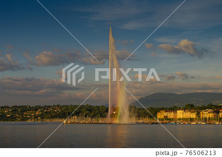 Leman lake at sunset and a super Jet fountain in the historical downtown of Geneva, Switzerland, summer Leman lake at sunset and a super Jet fountain in the historical downtown of Geneva, Switzerland, summer 76506213