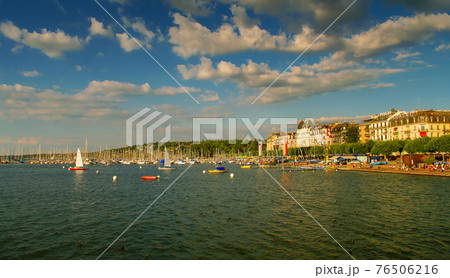 Leman lake at sunset and a super Jet fountain in the historical downtown of Geneva, Switzerland, summer Leman lake at sunset and a super Jet fountain in the historical downtown of Geneva, Switzerland, summer 76506216