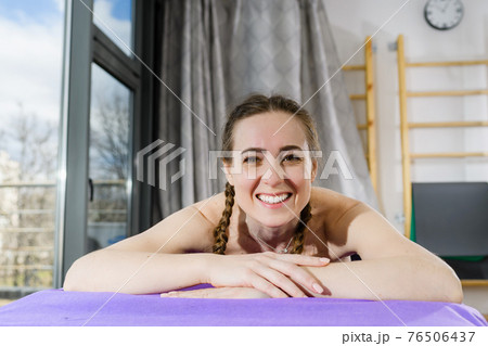 Portrait of smiling girl at spa massage Portrait of smiling girl at spa massage 76506437