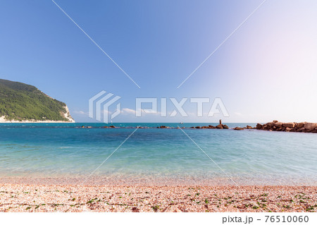 View of the clear emerald sea from the beach Urbani, riviera del Conero. Sirolo, Italy View of the clear emerald sea from the beach Urbani, riviera del Conero. Sirolo, Italy 76510060