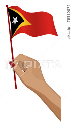 Female hand gently holds small flag of East Timor. Holiday design element. Cartoon vector on white background Female hand gently holds small flag of East Timor. Holiday design element. Cartoon vector on white background 76510872