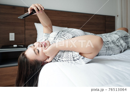 Woman videocalling friend 76513064