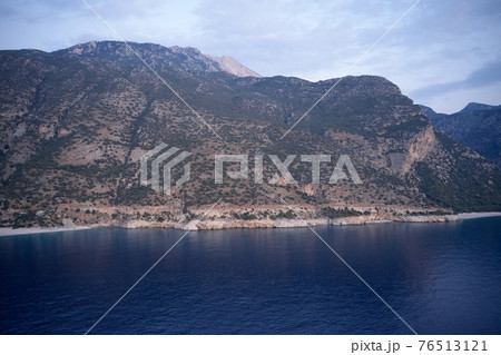 Aerial view of resort town on mountain coast. 76513121