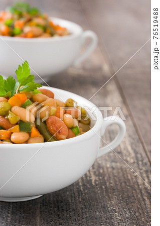 Healthy grain salad in bowl on wooden table Healthy grain salad in bowl on wooden table 76519488