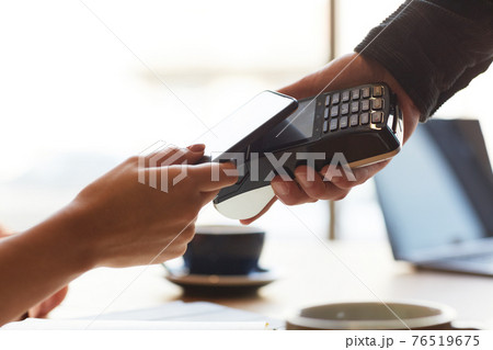 Client Paying via Smartphone Closeup Client Paying via Smartphone Closeup 76519675