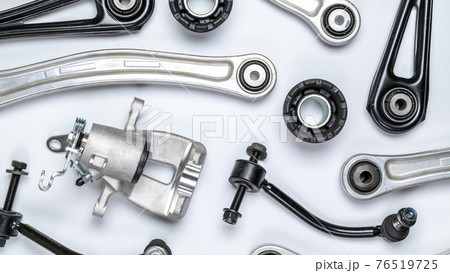 Mechanic part. Set of new metal car part. Auto motor mechanic spare or automotive piece isolated on white background. Automobile engine service with space for text. Mechanic part. Set of new metal car part. Auto motor mechanic spare or automotive piece isolated on white background. Automobile engine service with space for text. 76519725