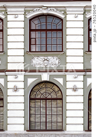 Two windows on a gray wall. Two windows on a gray wall. 76520040