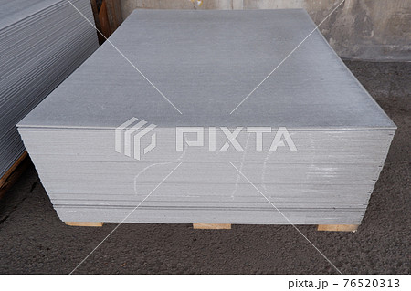 asbestos-cement slates stacked for use in home construction. asbestos-cement slates stacked for use in home construction. 76520313