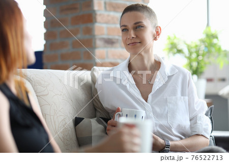 Stylish women have fun talking and drinking coffee 76522713