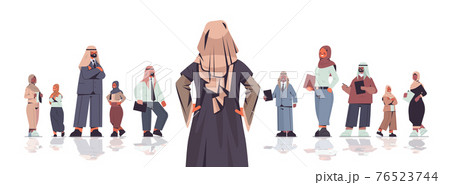 rear view businesswoman standing in front of arabic businesspeople team leader leadership concept 76523744