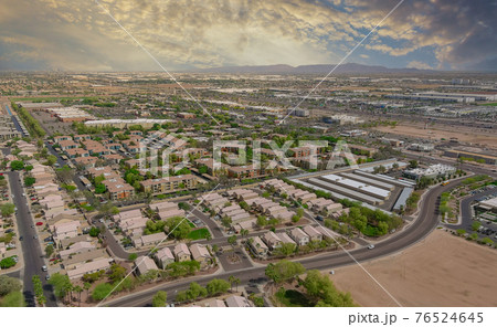 Aerial view of mixing single family homes, apartment buildings a residential district a Avondale near Phoenix Arizona US 76524645