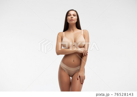 Young beautiful girl shows her gorgeous Breasts - Stock Photo