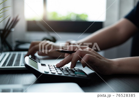 Businessman accountant or financial expert analyze business report graph and finance chart at corporate office. Concept of finance economy, banking business and stock market research 76528385