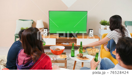 friends watch green screen TV 76528424