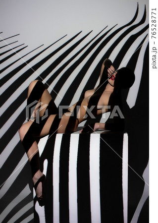Fashion portrait of young lady with shadow on her body 76528771