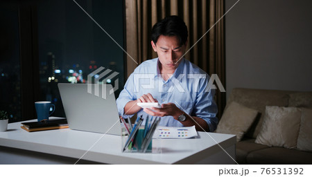 businessman overtime work at home 76531392