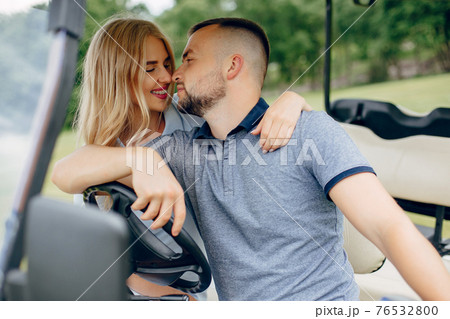 Beautiful couple spend time on a summer forest Beautiful couple spend time on a summer forest 76532800