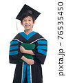 Asian boy student wearing graduation gown with ploma on white background 76535450