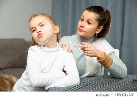 Unhappy young woman discuss conflict with small daughter 76535519