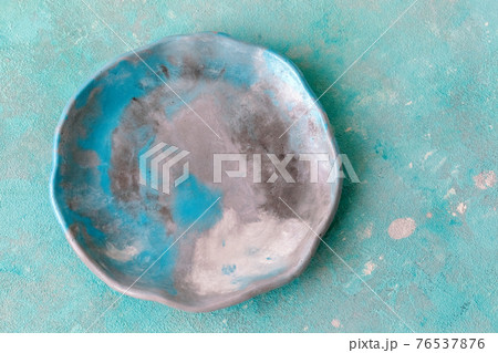 Stone emerald platter on conrete table, mockup 76537876
