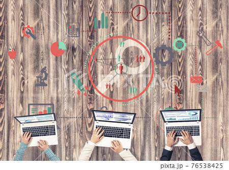 Top view of businesspeople sitting at table and using gadgets Top view of businesspeople sitting at table and using gadgets 76538425