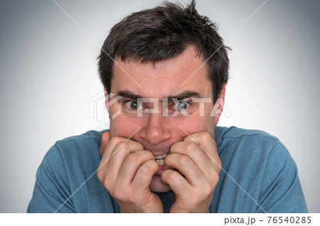 Nervous man biting his nails - nervous breakdown 76540285