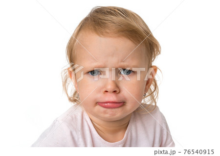 Little baby with sad expression in face Little baby with sad expression in face 76540915