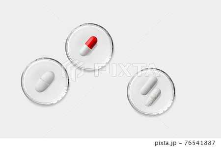 Red white, white and capsule with granules pills in glass transparent petri dish isolated 3d Red white, white and capsule with granules pills in glass transparent petri dish isolated 3d 76541887