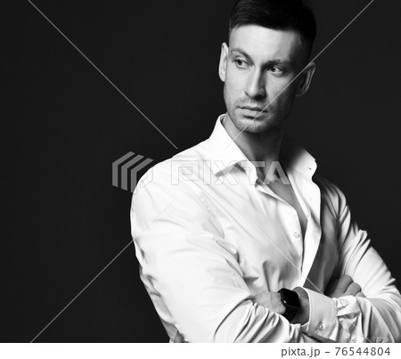 Portrait of distrustful businessman in official Portrait of distrustful businessman in official 76544804
