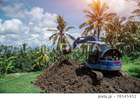 industrial bulldozer excavate ground and soil in tropical rain forest industrial bulldozer excavate ground and soil in tropical rain forest 76545452