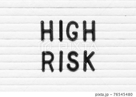 Black alphabet letter in word high risk on white felt board background 76545480