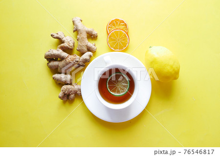 Top view of ginger tea on wooden background. 76546817