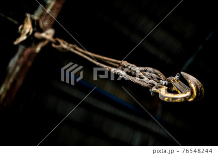 Large old iron chains and hooks,Old steel factory Retro photography Industrial, old factory, metal pipe, dark interior decoration of large hall for production or warehouse.soft focus. Large old iron chains and hooks,Old steel factory Retro photography Industrial, old factory, metal pipe, dark interior decoration of large hall for production or warehouse.soft focus. 76548244