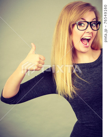 Portrait of happy blonde woman smiling with joy 76549160