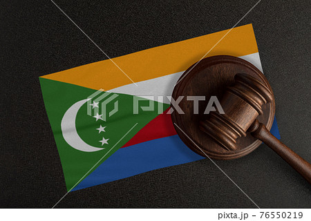 Judges gavel and the flag of Comoros. Law and Justice. Constitutional law Judges gavel and the flag of Comoros. Law and Justice. Constitutional law 76550219