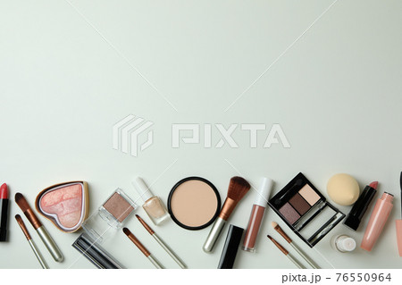 Different makeup cosmetics on white background, space for text 76550964