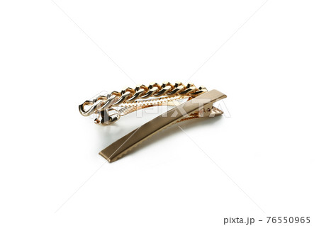 Golden hair clips isolated on white background 76550965
