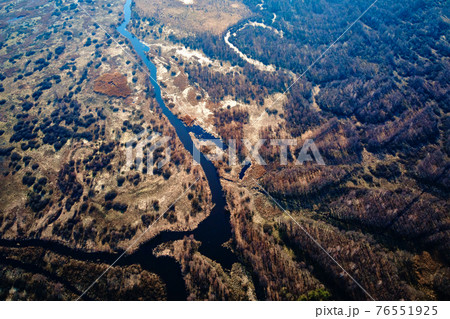Overflowing river in the valley, aerial view 76551925