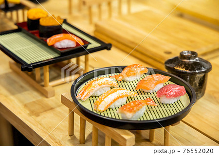 Homemade sushi with salmon, selective focus. Homemade sushi with salmon, selective focus. 76552020