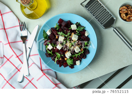 Concept of tasty eating with beet salad on white textured table Concept of tasty eating with beet salad on white textured table 76552115