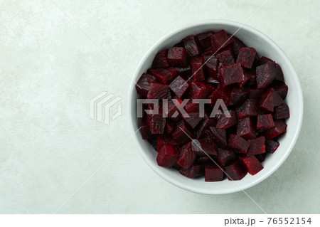 Bowl with fresh beet salad on white textured background Bowl with fresh beet salad on white textured background 76552154