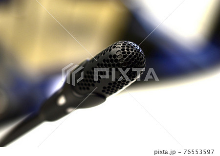 Black microphone close - up in the hall with bokeh Black microphone close - up in the hall with bokeh 76553597