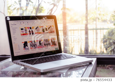 Online shopping website on laptop. Home shopping Online shopping website on laptop. Home shopping 76554433