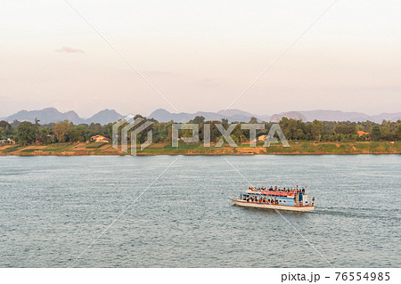 NAKHON PHANOM, THAILAND - NOV 27, 2020 : Tourist boat in Mekong river Nakhon phanom Thailand to Lao 76554985