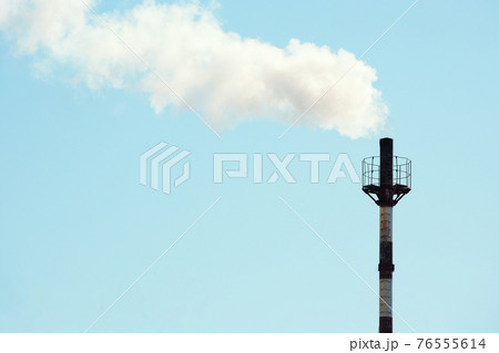 Smoke is coming from the gas boiler room pipe against the blue sky. Smoke is coming from the gas boiler room pipe against the blue sky. 76555614