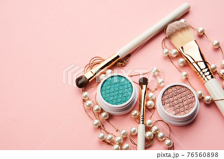 eyeshadow accessories beads makeup brushes collection professional cosmetics on pink background 76560898
