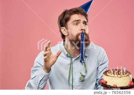 bearded man with cake on pink background emotions cropped view bearded man with cake on pink background emotions cropped view 76562356