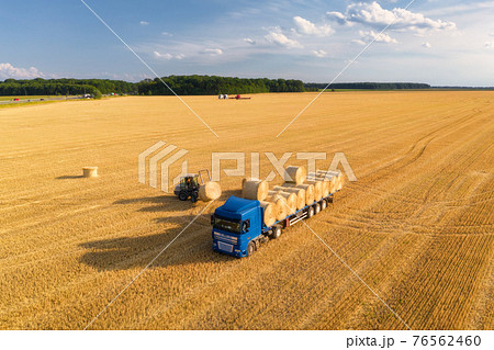 Aerial view of truck with hay bales. Agricultural machinery 76562460